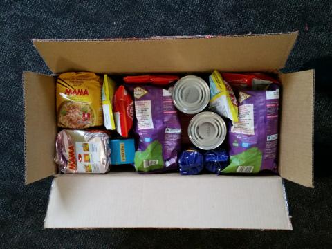 A box of tightly-packed groceries.