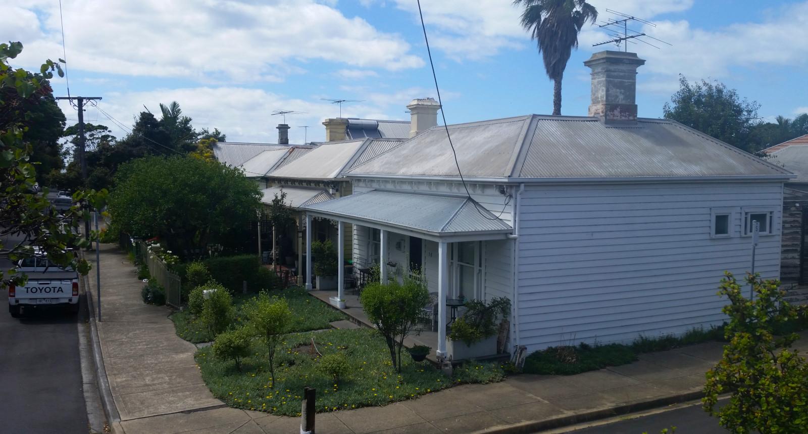 Victorian-era cottages with chimneys and bull-nose verandahs.