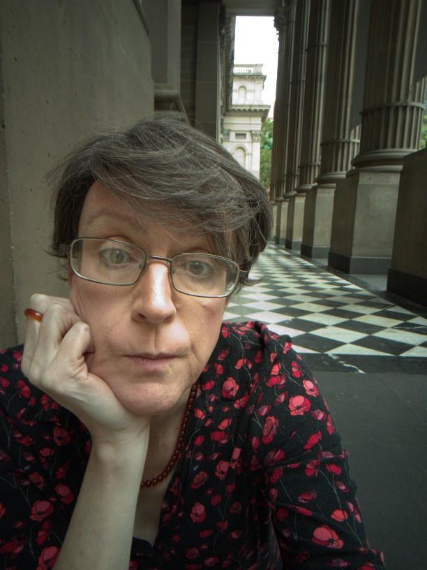 Old lady sitting on the steps of the State Library of Victoria, staring at a piece of nothing somewhere in the middle distance.